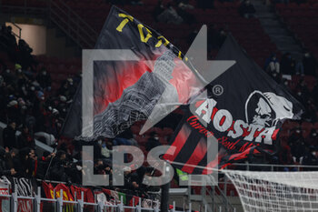 2022-01-13 - A fan waves a giant flag during the Coppa Italia 2021/22 football match between AC Milan and Genoa CFC at Giuseppe Meazza Stadium, Milan, Italy on January 14, 2022 - AC MILAN VS GENOA CFC - ITALIAN CUP - SOCCER
