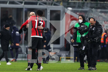 2022-01-13 - Rafael Leao of AC Milan celebrates the victory at the end of the match with Stefano Pioli Head Coach of AC Milan during the Coppa Italia 2021/22 football match between AC Milan and Genoa CFC at Giuseppe Meazza Stadium, Milan, Italy on January 14, 2022 - AC MILAN VS GENOA CFC - ITALIAN CUP - SOCCER