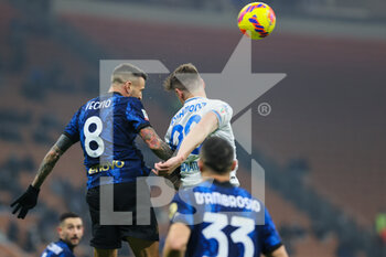 2022-01-19 - Andrea Pinamonti of Empoli FC and Matias Vecino of FC Internazionale in action during the Coppa Italia 2021/22 football match between FC Internazionale and Empoli FC at Giuseppe Meazza Stadium, Milan, Italy on January 19, 2022 - INTER - FC INTERNAZIONALE VS EMPOLI FC - ITALIAN CUP - SOCCER