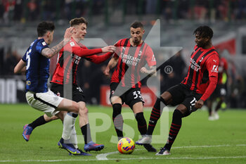 2022-03-01 - Rade Krunic of AC Milan, Rafael Leao of AC Milan, Alexis Saelemaekers of AC Milan and Alessandro Bastoni of FC Internazionale fights for the ball during the Coppa Italia 2021/22 football match between AC Milan and FC Internazionale at Giuseppe Meazza Stadium, Milan, Italy on March 01, 2022 - AC MILAN VS FC INTERNAZIONALE - ITALIAN CUP - SOCCER