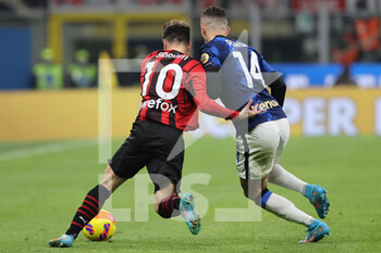 2022-03-01 - Ivan Perisic of FC Internazionale fights for the ball against Brahim Diaz of AC Milan during the Coppa Italia 2021/22 football match between AC Milan and FC Internazionale at Giuseppe Meazza Stadium, Milan, Italy on March 01, 2022 - AC MILAN VS FC INTERNAZIONALE - ITALIAN CUP - SOCCER
