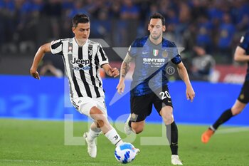 2022-05-11 - ROME, ITALY - May 11 : Paulo Dybala (L) of  FC Juventus in action against  Hakan Calhanoglu  (R) of Inter Milan FC  during the  Italian Cup final  soccer match between  Inter  FC Juventus and Inter Milan FC Stadio Olimpico on May 11,2022 in Rome, Italy.  - FINAL 2021/2022 - JUVENTUS FC VS INTER - FC INTERNAZIONALE - ITALIAN CUP - SOCCER