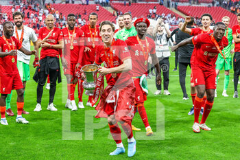 2022-05-14 - Kostas Tsimikas (21) of Liverpool celebrates winning the cup during the English FA Cup, Final football match between Chelsea and Liverpool on May 14, 2022 at Wembley Stadium in London, England - FINAL - CHELSEA VS LIVERPOOL - ENGLISH LEAGUE CUP - SOCCER