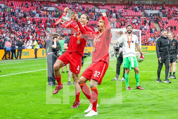 2022-05-14 - Virgil van Dijk (4) and Joel Matip (32) of Liverpool celebrates at full time during the English FA Cup, Final football match between Chelsea and Liverpool on May 14, 2022 at Wembley Stadium in London, England - FINAL - CHELSEA VS LIVERPOOL - ENGLISH LEAGUE CUP - SOCCER