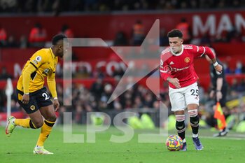 2022-01-04 - Manchester United Midfielder Jadon Sancho (25) takes on Wolverhampton Wanderers defender Nelson Semedo (22) during the English championship Premier League football match between Manchester United and Wolverhampton Wanderers on January 3, 2022 at Old Trafford in Manchester, England - MANCHESTER UNITED VS WOLVERHAMPTON WANDERERS - ENGLISH PREMIER LEAGUE - SOCCER