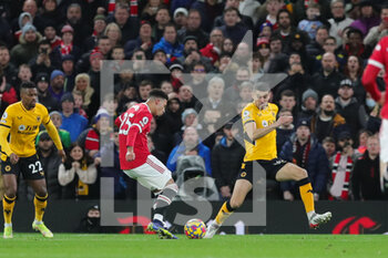 2022-01-04 - Manchester United Midfielder Jadon Sancho (25) shoots at goal during the English championship Premier League football match between Manchester United and Wolverhampton Wanderers on January 3, 2022 at Old Trafford in Manchester, England - MANCHESTER UNITED VS WOLVERHAMPTON WANDERERS - ENGLISH PREMIER LEAGUE - SOCCER