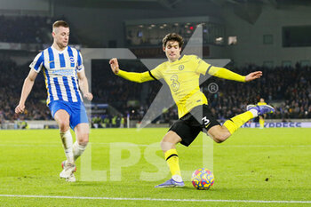 2022-01-19 - Chelsea Defender Marcos Alonso crosses the ball from Brighton and Hove Albion defender Adam Webster during the English championship Premier League football match between Brighton and Hove Albion and Chelsea on January 18, 2022 at the American Express Community Stadium in Brighton and Hove, England - BRIGHTON AND HOVE ALBION VS CHELSEA - ENGLISH PREMIER LEAGUE - SOCCER