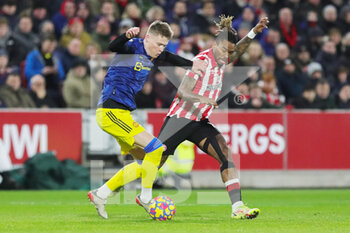 2022-01-20 - Manchester United Midfielder Scott McTominay (39) battles with Brentford forward Ivan Toney (17) during the English championship Premier League football match between Brentford and Manchester United on January 19, 2022 at Brentford Community Stadium in Brentford, England - BRENTFORD VS MANCHESTER UNITED - ENGLISH PREMIER LEAGUE - SOCCER