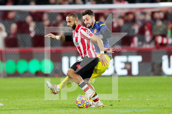 2022-01-20 - Brentford forward Marcus Forss (9) battles with Manchester United defender Alex Telles (27) during the English championship Premier League football match between Brentford and Manchester United on January 19, 2022 at Brentford Community Stadium in Brentford, England - BRENTFORD VS MANCHESTER UNITED - ENGLISH PREMIER LEAGUE - SOCCER