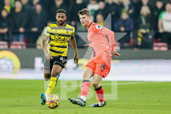 2022-01-21 - Jacob Lungi Sorensen (19) of Norwich City and Emmanuel Dennis of Watford during the English championship Premier League football match between Watford and Norwich City on January 21, 2022 at Vicarage Road in Watford, England - WATFORD VS NORWICH CITY - ENGLISH PREMIER LEAGUE - SOCCER