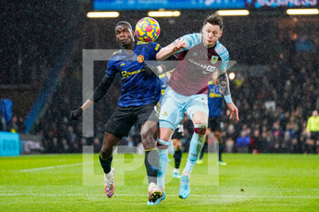 2022-02-08 - Manchester United midfielder Paul Pogba (6) wrestles with Burnley forward Wout Weghorst (9) during the English championship Premier League football match between Burnley and Manchester United on February 8, 2022 at Turf Moor in Burnley, England - BURNLEY VS MANCHESTER UNITED - ENGLISH PREMIER LEAGUE - SOCCER