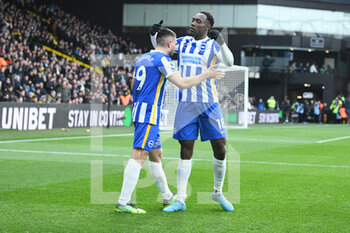 2022-02-12 - Brighton and Hove Albion forward Neal Maupay (9) scores 0-1 and celebrates with Danny Welbeck during the English championship Premier League football match between Watford and Brighton and Hove Albion on February 12, 2022 at Vicarage Road in Watford, England - WATFORD VS BRIGHTON AND HOVE ALBION - ENGLISH PREMIER LEAGUE - SOCCER