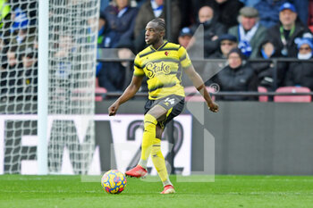 2022-02-12 - Watford defender Hassane Kamara during the English championship Premier League football match between Watford and Brighton and Hove Albion on February 12, 2022 at Vicarage Road in Watford, England - WATFORD VS BRIGHTON AND HOVE ALBION - ENGLISH PREMIER LEAGUE - SOCCER