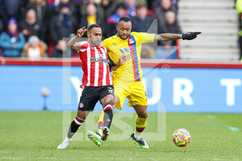 2022-02-12 - Jordan Ayew (9) of Crystal Palace and Rico Henry (3) of Brentford during the English championship Premier League football match between Brentford and Crystal Palace on February 12, 2022 at Brentford Community Stadium in Brentford, England - BRENTFORD VS CRYSTAL PALACE - ENGLISH PREMIER LEAGUE - SOCCER