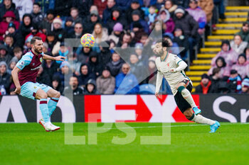 2022-02-13 - Burnley defender Erik Pieters (23) and Liverpool forward Mohamed Salah (11) during the English championship Premier League football match between Burnley and Liverpool on February 13, 2022 at Turf Moor in Burnley, England - BURNLEY VS LIVERPOOL - ENGLISH PREMIER LEAGUE - SOCCER