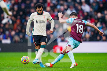 2022-02-13 - Liverpool forward Mohamed Salah (11) and Burnley midfielder Ashley Westwood (18) during the English championship Premier League football match between Burnley and Liverpool on February 13, 2022 at Turf Moor in Burnley, England - BURNLEY VS LIVERPOOL - ENGLISH PREMIER LEAGUE - SOCCER