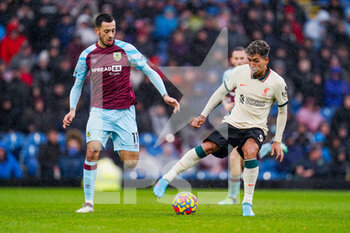 2022-02-13 - Liverpool forward Roberto Firmino (9) and Dwight McNeil of Burnley during the English championship Premier League football match between Burnley and Liverpool on February 13, 2022 at Turf Moor in Burnley, England - BURNLEY VS LIVERPOOL - ENGLISH PREMIER LEAGUE - SOCCER