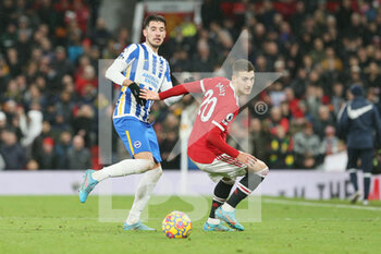 2022-02-16 - Manchester United Defender Diogo Dalot (20) battles with Brighton and Hove Albion midfielder Jakub Moder (15) during the English championship Premier League football match between Manchester United and Brighton and Hove Albion on February 15, 2022 at Old Trafford in Manchester, England - MANCHESTER UNITED VS BRIGHTON AND HOVE ALBION - ENGLISH PREMIER LEAGUE - SOCCER