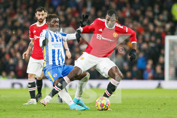 2022-02-16 - Manchester United Midfielder Paul Pogba (6) battles with Brighton and Hove Albion midfielder Yves Bissouma (8) during the English championship Premier League football match between Manchester United and Brighton and Hove Albion on February 15, 2022 at Old Trafford in Manchester, England - MANCHESTER UNITED VS BRIGHTON AND HOVE ALBION - ENGLISH PREMIER LEAGUE - SOCCER