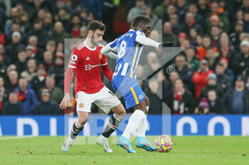 2022-02-16 - Brighton and Hove Albion midfielder Yves Bissouma (8) battles with Manchester United Midfielder Bruno Fernandes (18) during the English championship Premier League football match between Manchester United and Brighton and Hove Albion on February 15, 2022 at Old Trafford in Manchester, England - MANCHESTER UNITED VS BRIGHTON AND HOVE ALBION - ENGLISH PREMIER LEAGUE - SOCCER