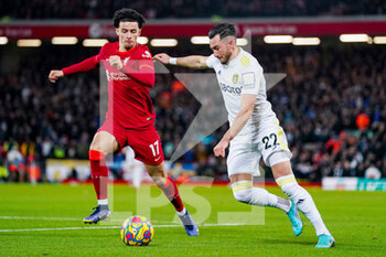 2022-02-23 - Leeds United midfielder Jack Harrison (22) and Curtis Jones of Liverpool during the English championship Premier League football match between Liverpool and Leeds United on February 23, 2022 at Anfield stadium in Liverpool, England - LIVERPOOL VS LEEDS UNITED - ENGLISH PREMIER LEAGUE - SOCCER