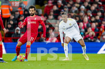 2022-02-23 - Mohamed Salah of Liverpool and Leeds United defender Junior Firpo during the English championship Premier League football match between Liverpool and Leeds United on February 23, 2022 at Anfield stadium in Liverpool, England - LIVERPOOL VS LEEDS UNITED - ENGLISH PREMIER LEAGUE - SOCCER