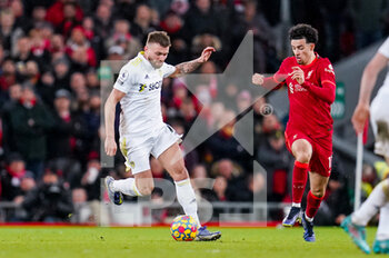 2022-02-23 - Leeds United defender Stuart Dallas (15) and Curtis Jones of Liverpool during the English championship Premier League football match between Liverpool and Leeds United on February 23, 2022 at Anfield stadium in Liverpool, England - LIVERPOOL VS LEEDS UNITED - ENGLISH PREMIER LEAGUE - SOCCER