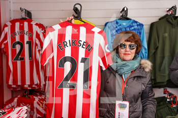 2022-02-26 - Christian Eriksen shirts being sold in the Brentford club store during the English championship Premier League football match between Brentford and Newcastle United on February 26, 2022 at Brentford Community Stadium in Brentford, England - BRENTFORD VS NEWCASTLE UNITED - ENGLISH PREMIER LEAGUE - SOCCER