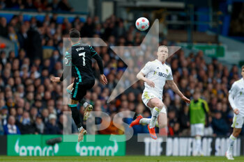 2022-03-13 - Leeds United midfielder Adam Forshaw (4) and Lukas Rupp of Norwich during the English championship Premier League football match between Leeds United and Norwich City on March 13, 2022 at Elland Road in Leeds, England - LEEDS UNITED VS NORWICH CITY - ENGLISH PREMIER LEAGUE - SOCCER