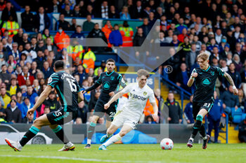 2022-03-13 - Leeds United midfielder Daniel James and Ozan Kabak, Brandon Williams of Norwich during the English championship Premier League football match between Leeds United and Norwich City on March 13, 2022 at Elland Road in Leeds, England - LEEDS UNITED VS NORWICH CITY - ENGLISH PREMIER LEAGUE - SOCCER