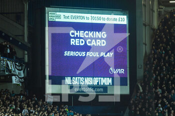 2022-03-17 - VAR checks a red card after Everton's midfielder Allan (6) on Newcastle United's forward Allan Saint-Maximin (10) during the English championship Premier League football match between Everton and Newcastle United on March 17, 2022 at Goodison Park in Liverpool, England - EVERTON VS NEWCASTLE UNITED - ENGLISH PREMIER LEAGUE - SOCCER