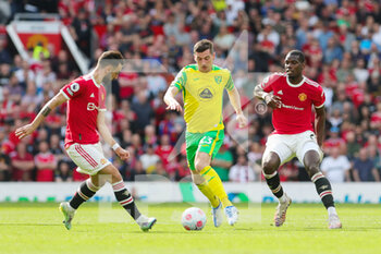 2022-04-17 - Manchester United Midfielder Bruno Fernandes (18) battles with Norwich City midfielder Kenny McLean (23) during the English championship Premier League football match between Manchester United and Norwich City on April 16, 2022 at Old Trafford in Manchester, England - MANCHESTER UNITED VS NORWICH CITY - ENGLISH PREMIER LEAGUE - SOCCER