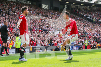 2022-04-17 - Manchester United Forward Cristiano Ronaldo (7) celebrates his goal 2-0 with Alex Telles during the English championship Premier League football match between Manchester United and Norwich City on April 16, 2022 at Old Trafford in Manchester, England - MANCHESTER UNITED VS NORWICH CITY - ENGLISH PREMIER LEAGUE - SOCCER