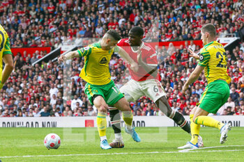 2022-04-17 - Manchester United Midfielder Paul Pogba (6) battles with Norwich City midfielder Milot Rashica (17) during the English championship Premier League football match between Manchester United and Norwich City on April 16, 2022 at Old Trafford in Manchester, England - MANCHESTER UNITED VS NORWICH CITY - ENGLISH PREMIER LEAGUE - SOCCER