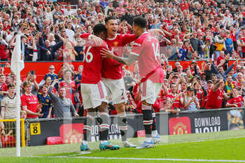 2022-04-17 - Manchester United Forward Cristiano Ronaldo (7) celebrates his goal 1-0 with Anthony Elanga, Jesse Lingard during the English championship Premier League football match between Manchester United and Norwich City on April 16, 2022 at Old Trafford in Manchester, England - MANCHESTER UNITED VS NORWICH CITY - ENGLISH PREMIER LEAGUE - SOCCER