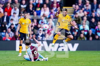 2022-04-24 - Burnley forward Wout Weghorst (9) tackles Wolverhampton Wanderers midfielder Joao Moutinho (28) during the English championship Premier League football match between Burnley and Wolverhampton Wanderers on April 24, 2022 at Turf Moor in Burnley, England - BURNLEY VS WOLVERHAMPTON WANDERERS - ENGLISH PREMIER LEAGUE - SOCCER