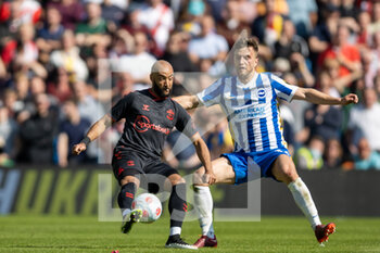 2022-04-24 - Southampton midfielder Nathan Redmond (11) and Brighton and Hove Albion defender Joel Veltman (34) during the English championship Premier League football match between Brighton and Hove Albion and Southampton on April 24, 2022 at the American Express Community Stadium in Brighton and Hove, England - BRIGHTON AND HOVE ALBION VS SOUTHAMPTON - ENGLISH PREMIER LEAGUE - SOCCER