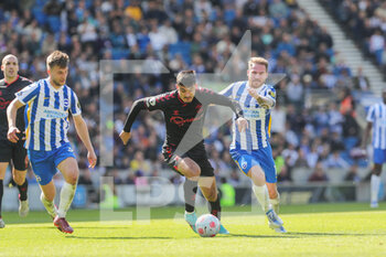 2022-04-24 - Southampton striker Armando Broja (18) battles with Brighton and Hove Albion forward Alexis Mac Allister (10) during the English championship Premier League football match between Brighton and Hove Albion and Southampton on April 24, 2022 at the American Express Community Stadium in Brighton and Hove, England - BRIGHTON AND HOVE ALBION VS SOUTHAMPTON - ENGLISH PREMIER LEAGUE - SOCCER