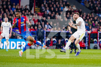 2022-04-25 - Leeds United defender Stuart Dallas (15) and Jordan Ayew of Crystal Palace during the English championship Premier League football match between Crystal Palace and Leeds United on April 25, 2022 at Selhurst Park in London, England - CRYSTAL PALACE VS LEEDS UNITED - ENGLISH PREMIER LEAGUE - SOCCER