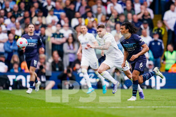 2022-04-30 - Leeds United defender Stuart Dallas (15) and Manchester City defender Nathan Ake (6) during the English championship Premier League football match between Leeds United and Manchester City on April 30, 2022 at Elland Road in Leeds, England - LEEDS UNITED VS MANCHESTER CITY - ENGLISH PREMIER LEAGUE - SOCCER