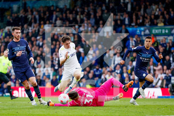 2022-04-30 - Leeds United midfielder Daniel James in duel with Manchester City goalkeeper Ederson during the English championship Premier League football match between Leeds United and Manchester City on April 30, 2022 at Elland Road in Leeds, England - LEEDS UNITED VS MANCHESTER CITY - ENGLISH PREMIER LEAGUE - SOCCER