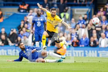 2022-05-07 - Ruben Loftus-Cheek (12) of Chelsea slides in and tackles Joao Moutinho (28) of Wolverhampton Wanderers during the English championship Premier League football match between Chelsea and Wolverhampton Wanderers on May 7, 2022 at Stamford Bridge in London, England - CHELSEA VS WOLVERHAMPTON WANDERERS - ENGLISH PREMIER LEAGUE - SOCCER