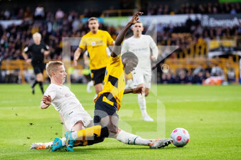 2022-05-11 - Manchester City defender Oleksandr Zinchenko tackles Wolverhampton Wanderers striker Chiquinho during the English championship Premier League football match between Wolverhampton Wanderers and Manchester City on May 11, 2022 at Molineux stadium in Wolverhampton, England - WOLVERHAMPTON WANDERERS VS MANCHESTER CITY - ENGLISH PREMIER LEAGUE - SOCCER