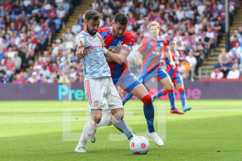 2022-05-23 - Manchester United Midfielder Bruno Fernandes (18) battles with Crystal Palace Joel Ward during the English championship Premier League football match between Crystal Palace and Manchester United on May 22, 2022 at Selhurst Park in London, England - CRYSTAL PALACE VS MANCHESTER UNITED - ENGLISH PREMIER LEAGUE - SOCCER
