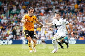 2022-08-06 - Ruben Neves of Wolverhampton, Leeds United midfielder Jack Harrison during the English championship Premier League football match between Leeds United and Wolverhampton Wanderers on August 6, 2022 at Elland Road in Leeds, England - FOOTBALL - ENGLISH CHAMP - LEEDS V WOLVERHAMPTON - ENGLISH PREMIER LEAGUE - SOCCER