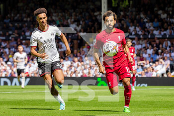 2022-08-06 - Fulham defender Antonee Robinson (33) and Liverpool forward Mohamed Salah (11) during the English championship Premier League football match between Fulham and Liverpool on August 6, 2022 at Craven Cottage in London, England - FOOTBALL - ENGLISH CHAMP - FULHAM V LIVERPOOL - ENGLISH PREMIER LEAGUE - SOCCER