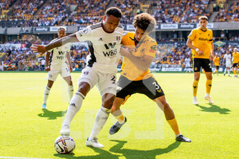 2022-08-13 - Wolverhampton Wanderers defender Rayan Ait-Nouri (3) battles for possession with Fulham defender Kenny Tete (2) during the English championship Premier League football match between Wolverhampton Wanderers and Fulham on August 13, 2022 at Molineux in Wolverhampton, England - FOOTBALL - ENGLISH CHAMP - WOLVERHAMPTON V FULHAM - ENGLISH PREMIER LEAGUE - SOCCER