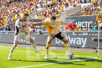 2022-08-13 - Wolverhampton Wanderers defender Max Kilman (23) battles for possession with Fulham midfielder Harrison Reed during the English championship Premier League football match between Wolverhampton Wanderers and Fulham on August 13, 2022 at Molineux in Wolverhampton, England - FOOTBALL - ENGLISH CHAMP - WOLVERHAMPTON V FULHAM - ENGLISH PREMIER LEAGUE - SOCCER