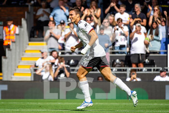 2022-08-20 - Fulham midfielder Joao Palhinha (26) scores and celebrates 2-0 during the English championship Premier League football match between Fulham and Brentford on August 20, 2022 at Craven Cottage in London, England - FOOTBALL - ENGLISH CHAMP - FULHAM V BRENTFORD - ENGLISH PREMIER LEAGUE - SOCCER