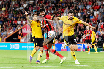 2022-09-01 - Philip Billing (29) of AFC Bournemouth battles for possession with Jonny Otto (19) of Wolverhampton Wanderers and Max Kilman (23) of Wolverhampton Wanderers during the English championship Premier League football match between Bournemouth and Wolverhampton Wanderers on August 31, 2022 at the Vitality Stadium in Bournemouth, England - FOOTBALL - ENGLISH CHAMP - BOURNEMOUTH V WOLVERHAMPTON - ENGLISH PREMIER LEAGUE - SOCCER
